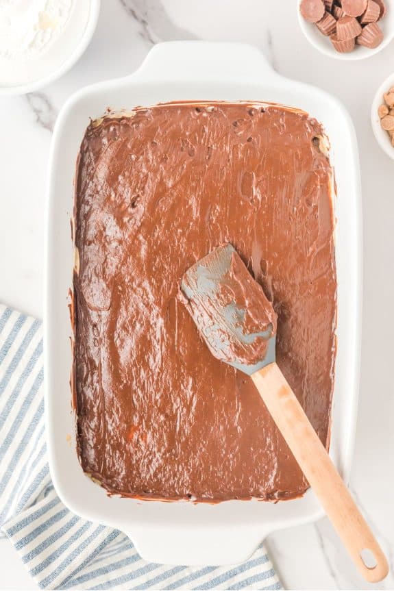 spatula spreading out chocolate pudding