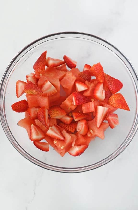 chopped strawberries and star-shaped watermelon in bowl