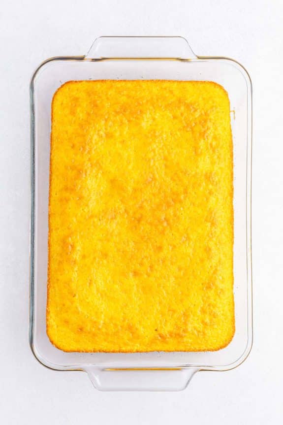 baked yellow sheet cake in 9x13 glass pan