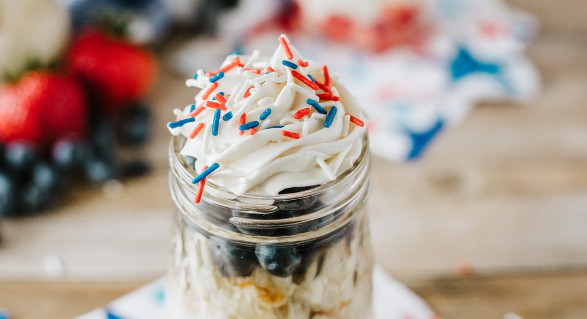 added whipped cream to the opening of the jar with red, white and blue sprinkles