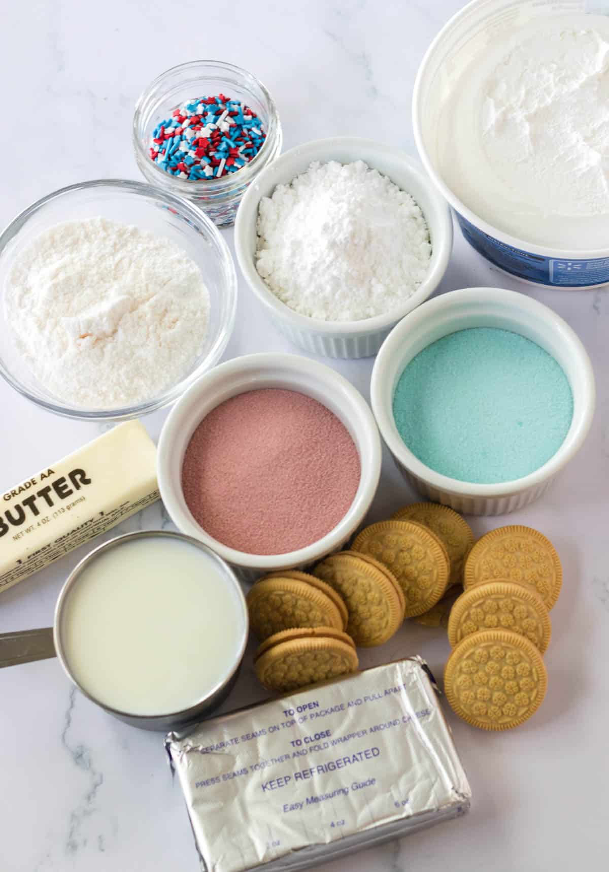ingredients in white bowls on counter with golden oreos