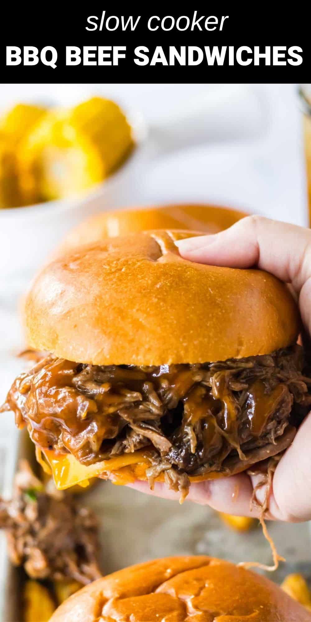 These Slow Cooker BBQ Beef Sandwiches are going to be your new favorite dinner!Tender beef just fallapart in a rich bbq sauce. Pile this high on soft buns and you will have one delicious sandwich.