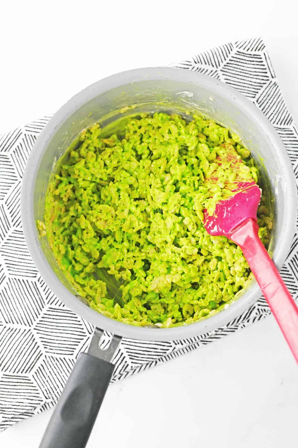 green rice krispies in saucepan
