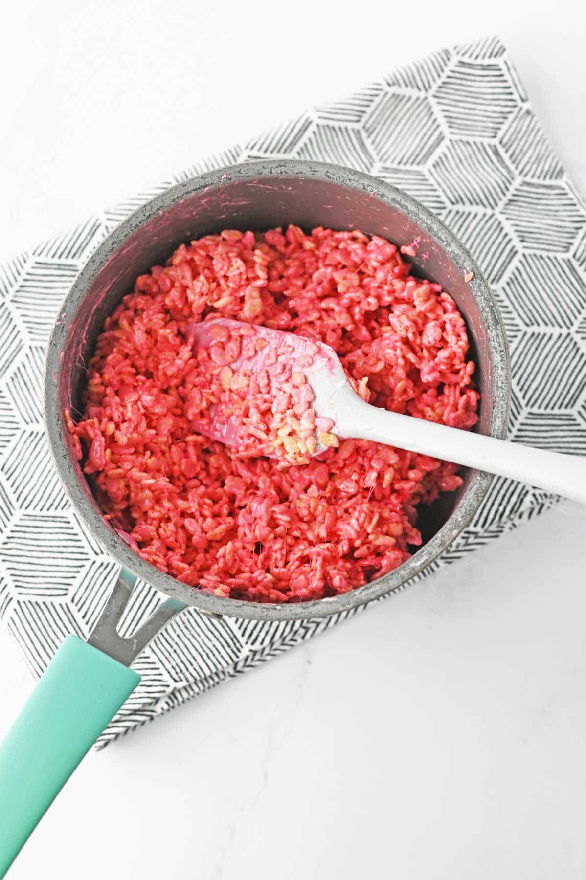 red rice krispies in saucepan