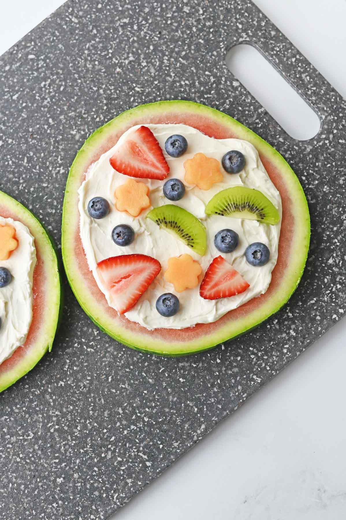 slice of watermelon with frosting and fruit