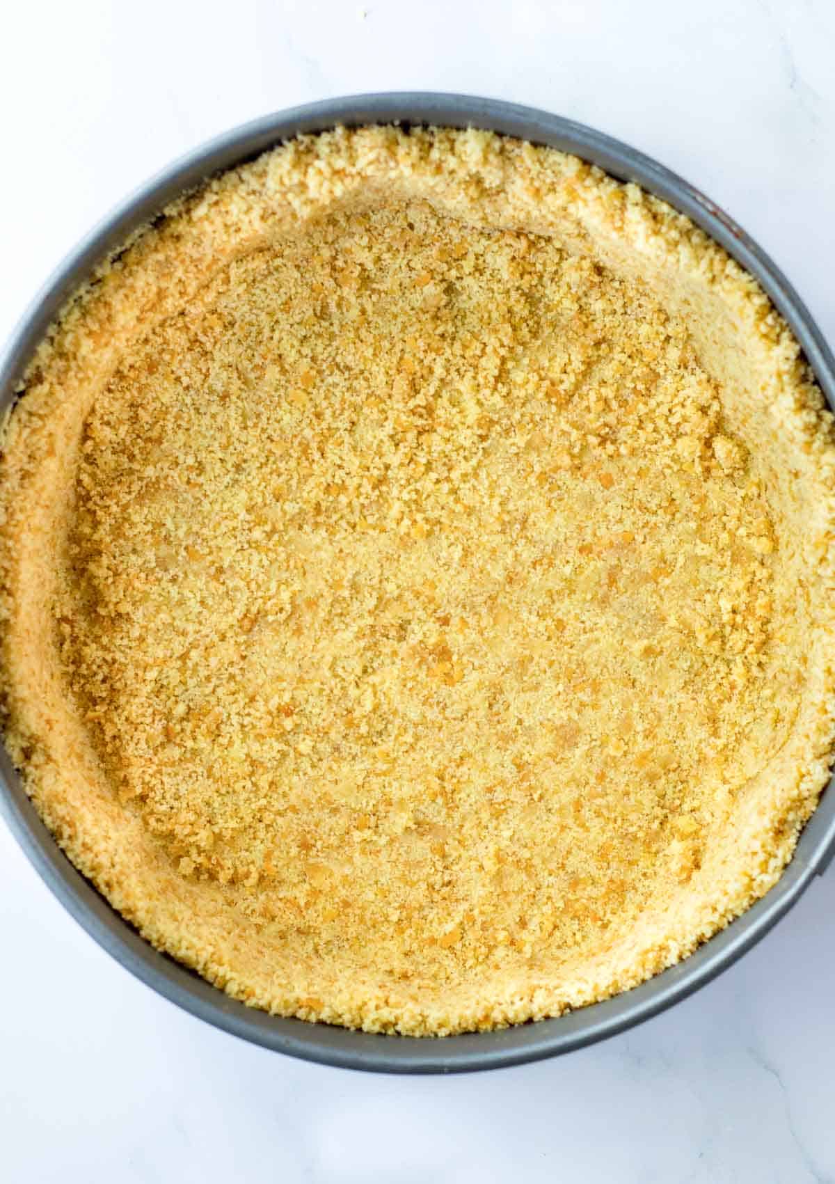 nilla wafer crumbs in bottom of spring form pan