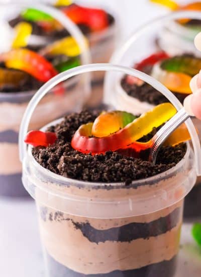 A jar of Dirt Cake Pudding Bucket with a spoon