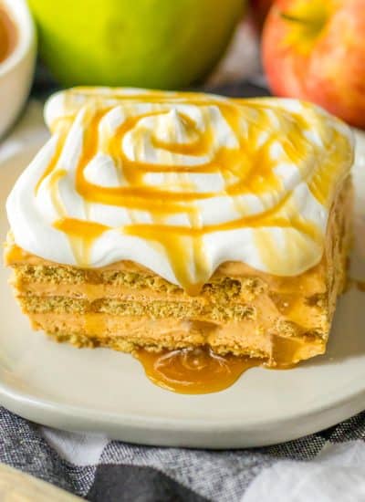 slice of caramel apple icebox cake showing layers and caramel dripping from sides