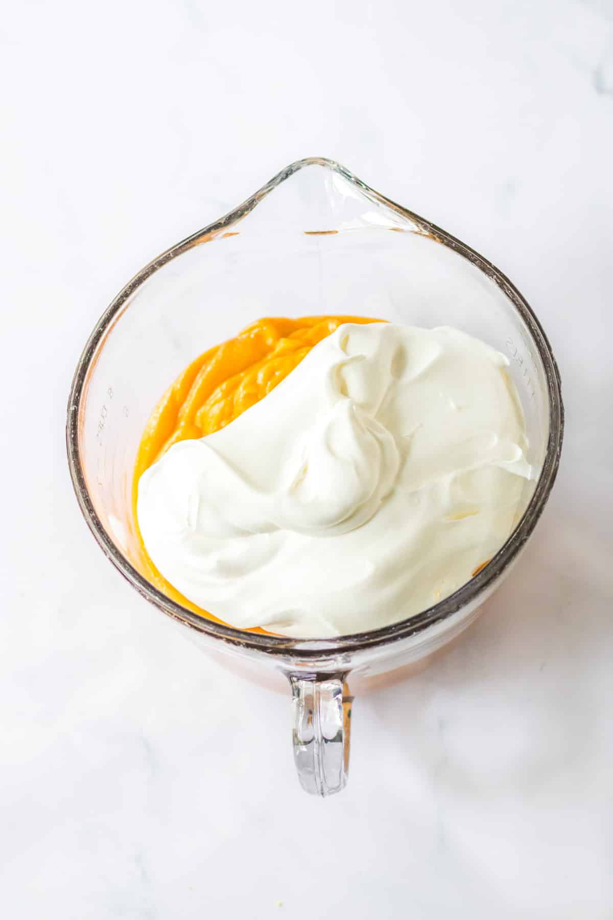 whipped cream in measuring cup