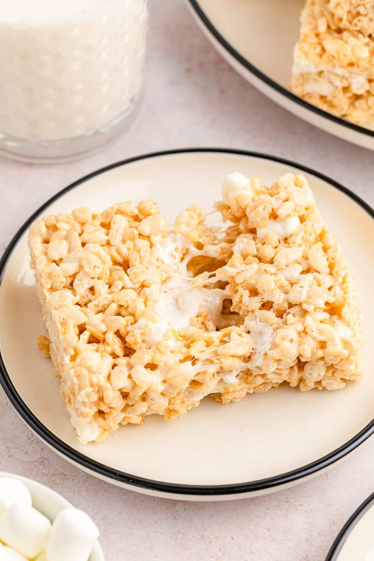 krispies treat pulled in half with gooey marshmallow in middle