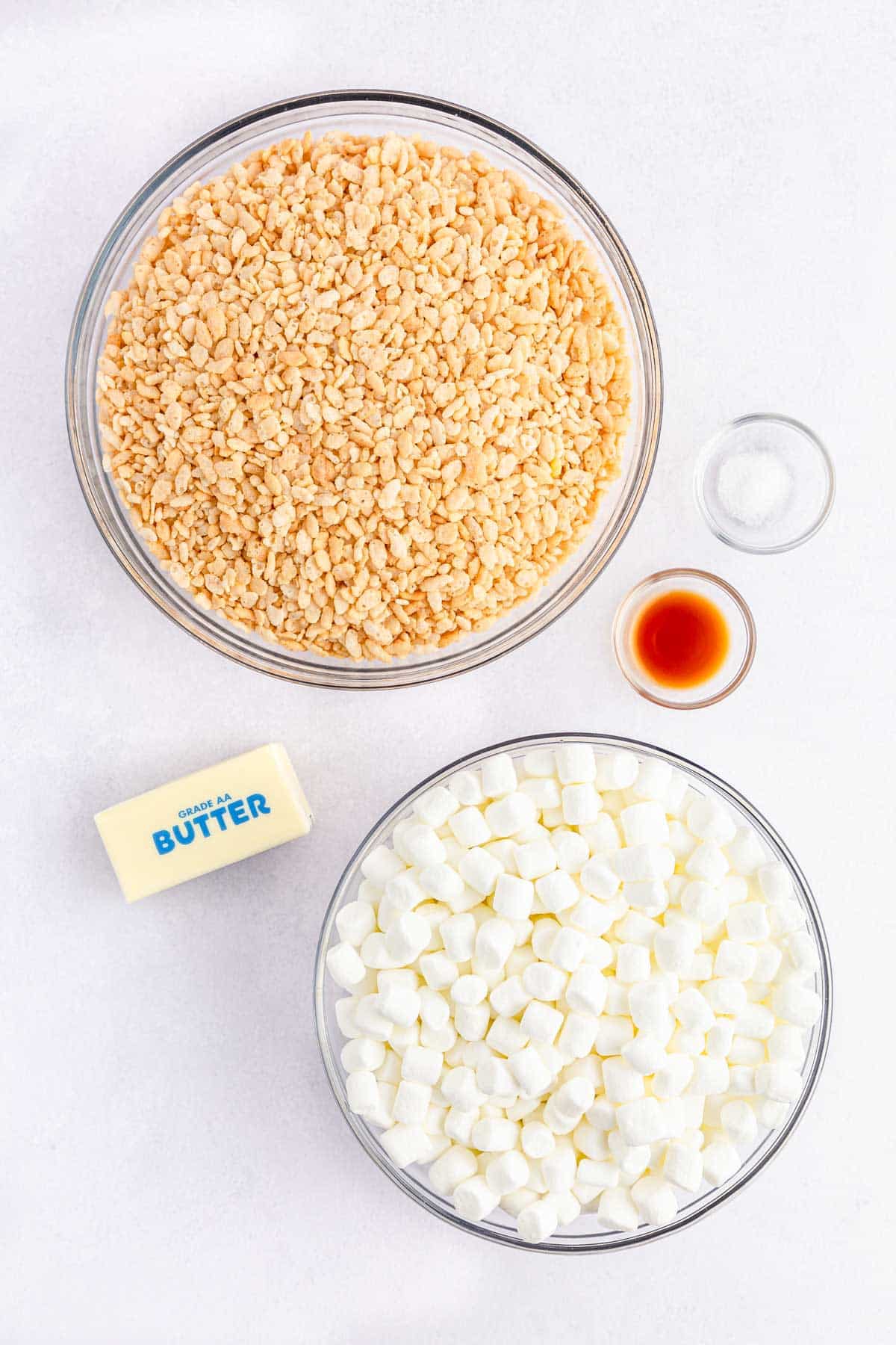 rice krispies cereal, vanilla, salt, butter, and mini marshmallows on counter