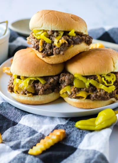 Four Slow Cooker Mississippi Sloppy Joes on a plate with fries.