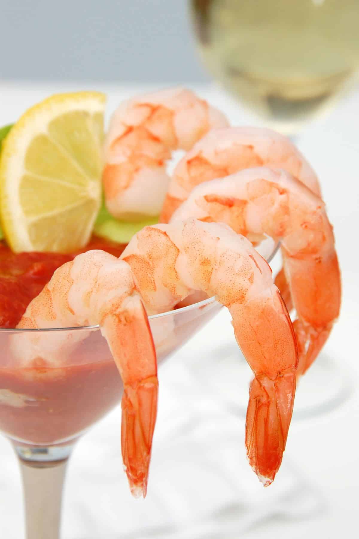 Shrimp cocktail in a martini glass.