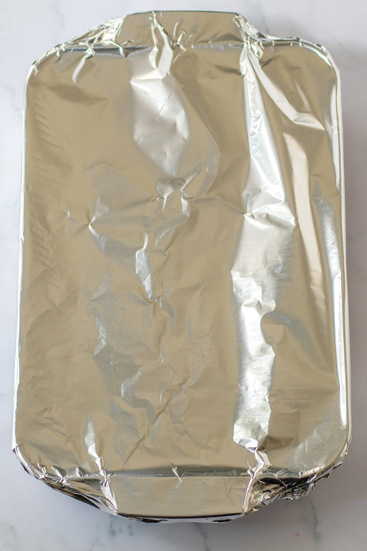 Putting over an aluminum foil to cover the meat is another process in preparing Beef Tips