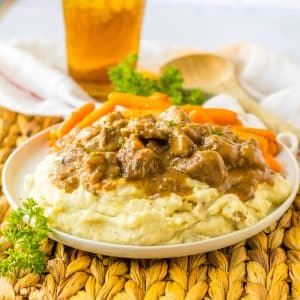 A plate of mashed potatoes Beef Tips