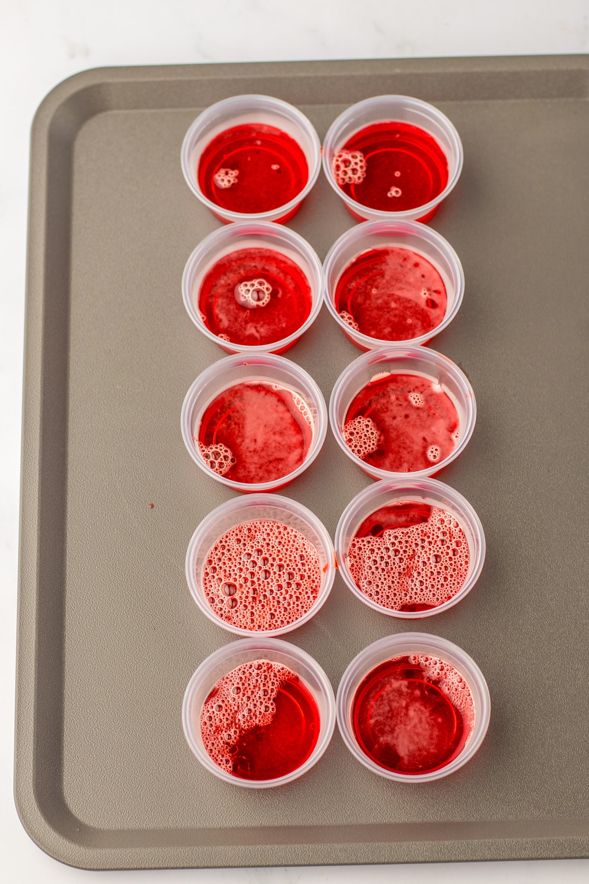 A tray of red jello for Santa Hat Jello Shots 