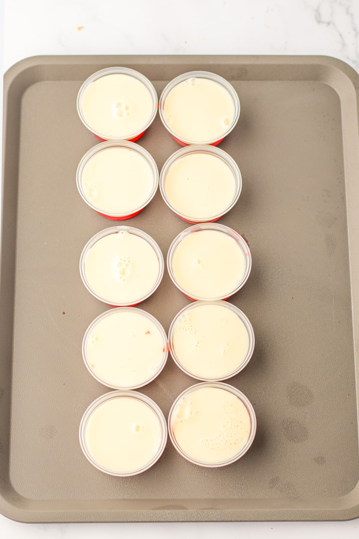 Another step in preparing Santa Hat Jello Shots  is to make the white jello layer