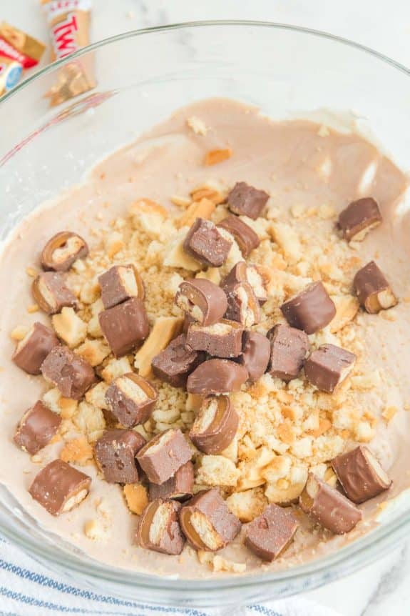 A bowl filled with a mixture of chocolate and peanut butter.