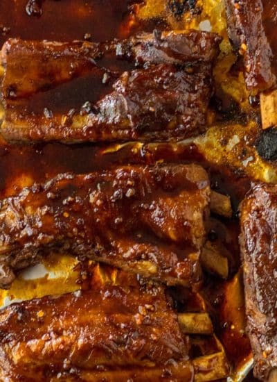 Slow cooker ribs on a baking sheet.