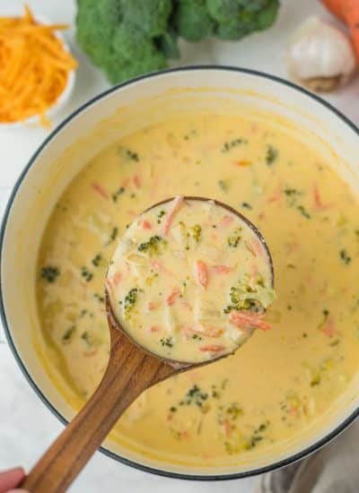 A bowl of soup with broccoli and carrots, perfect to serve with broccoli cheese soup.