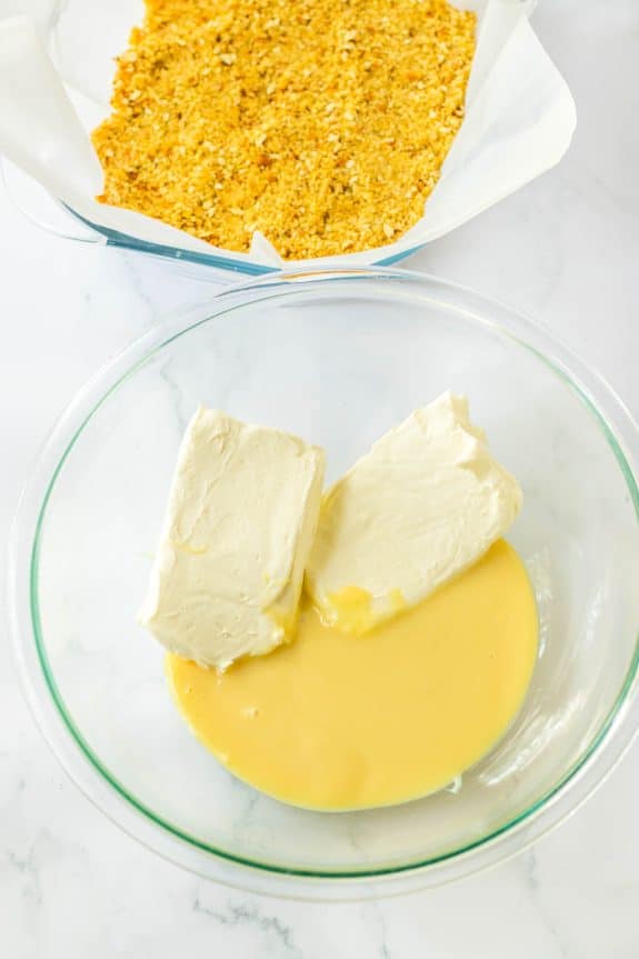 A bowl with cream cheese and sweetened condensed milk