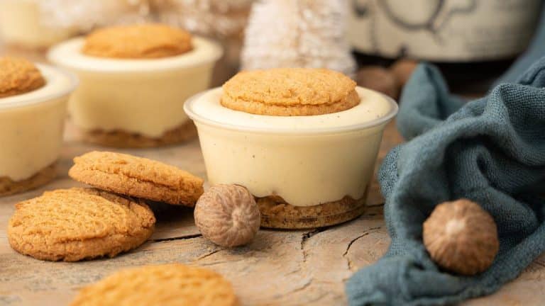 A group of dessert cups with cookies and nuts.