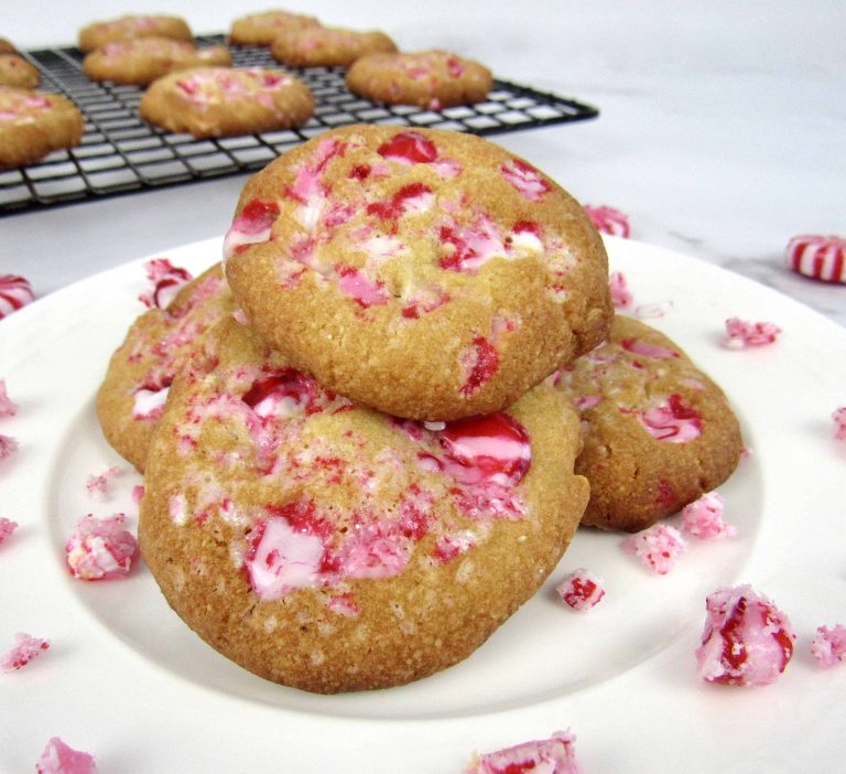 A stack of peppermint cookies on a white plate.
