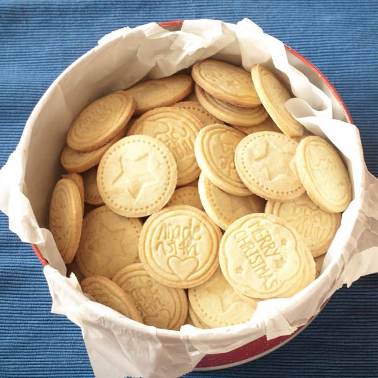 A bowl of cookies on a table.