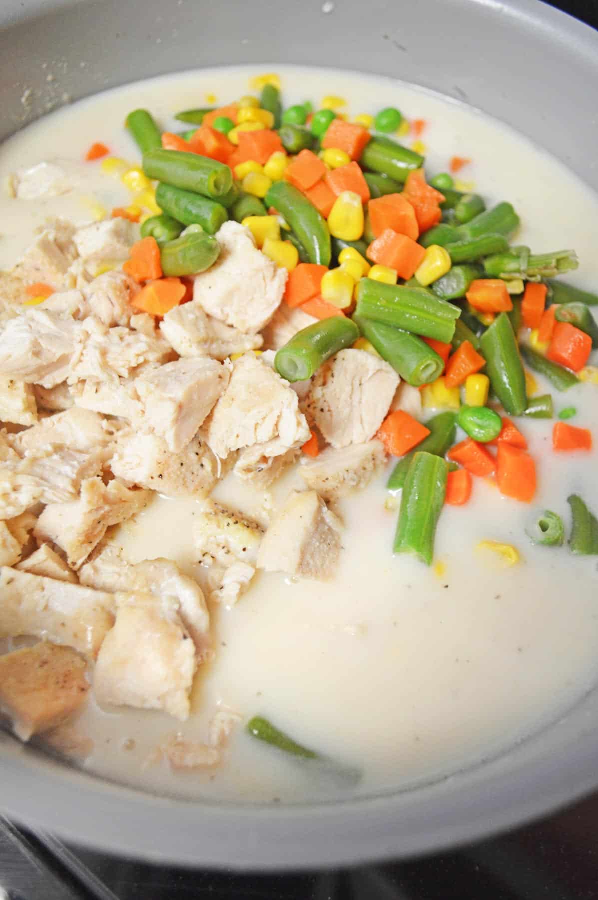 ingredients in bowl with chicken and vegetables