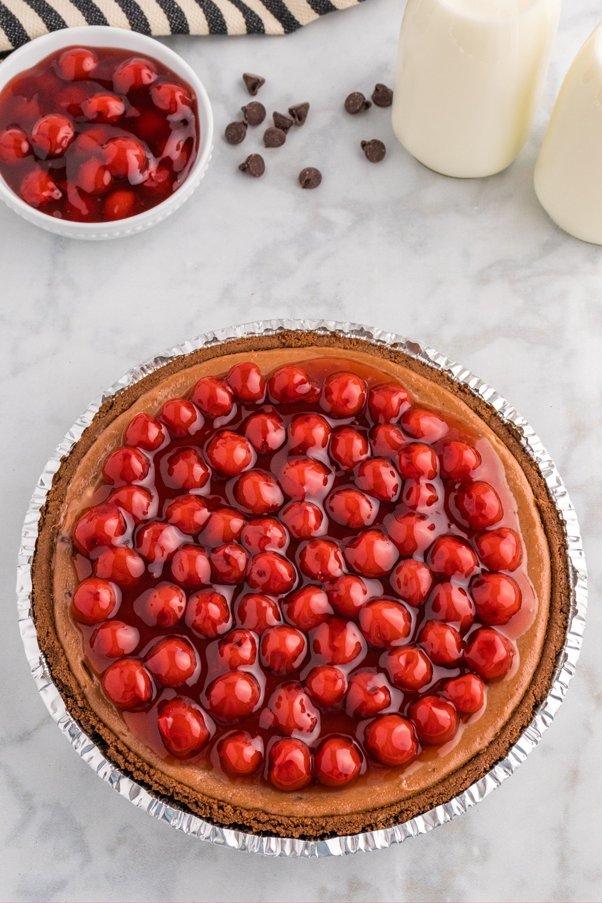 When the Chocolate Cherry Cheesecake is baked, add cherry topping on it.