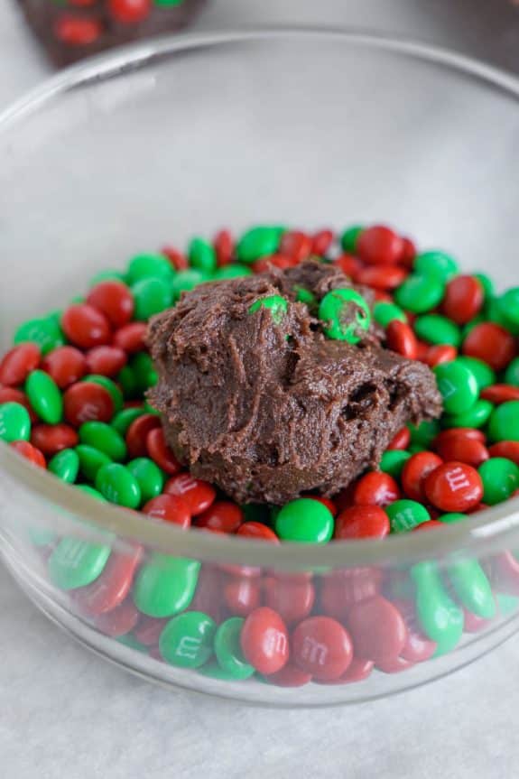 A bowl filled with chocolate and m&m's.