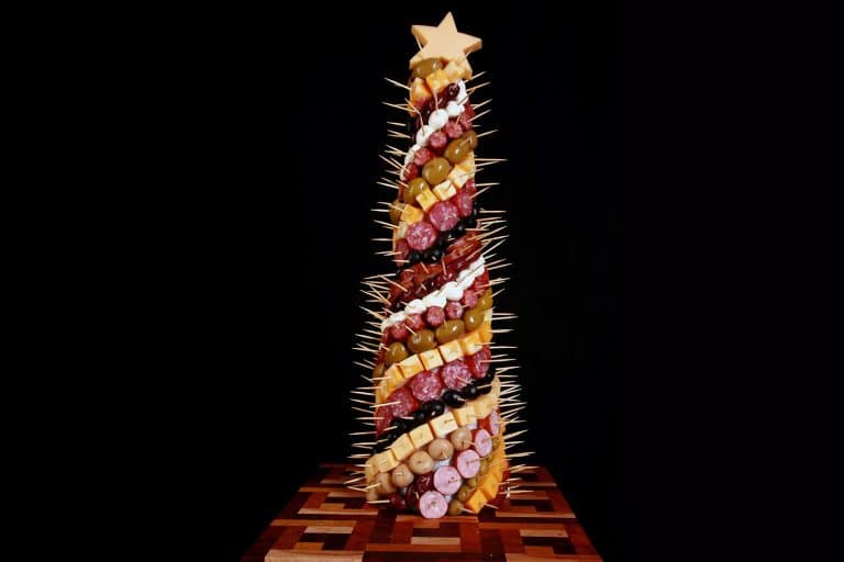 A christmas tree made out of cheese sticks.