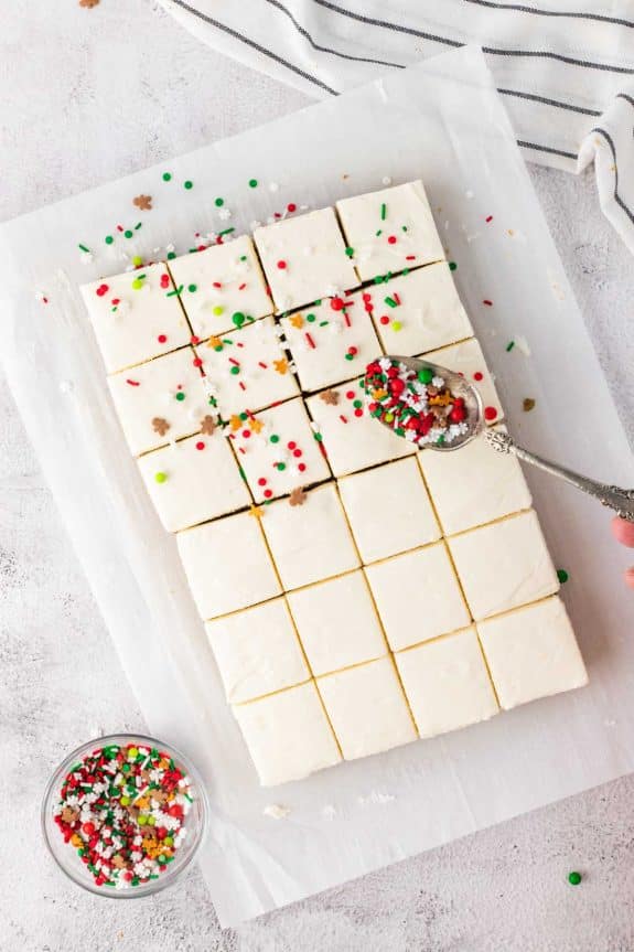 frosted gingerbread cookie bars with sprinkles on top.