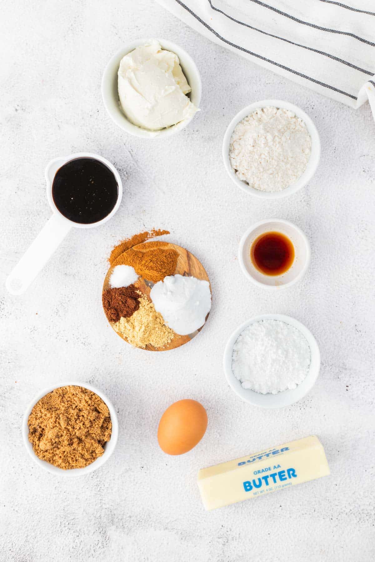 The ingredients for gingerbread cookie bars on a white counter.