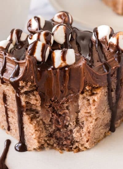 A hot chocolate poke cake with marshmallows on top.