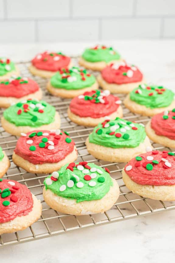 Christmas cookies on a cooling rack with green and red icing.