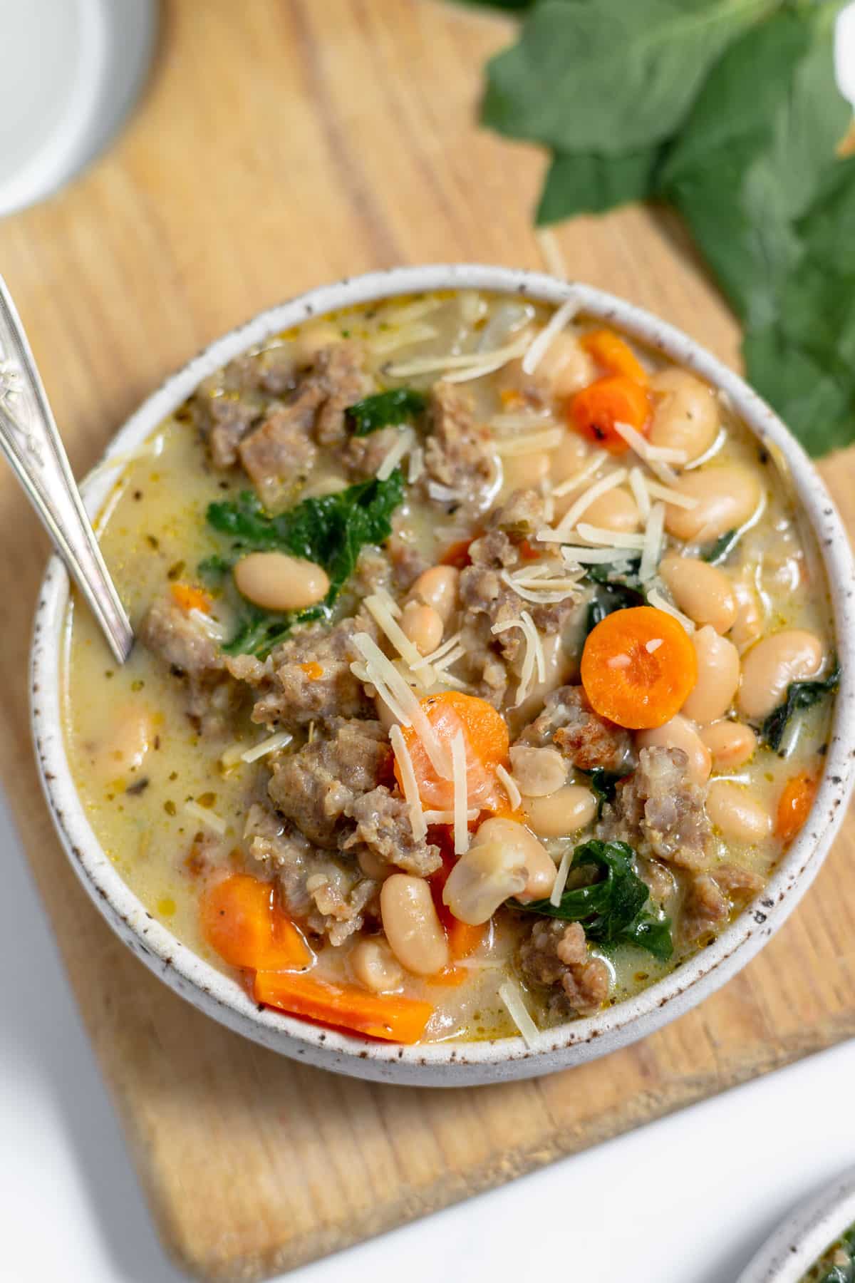 A bowl of soup with meat and vegetables.