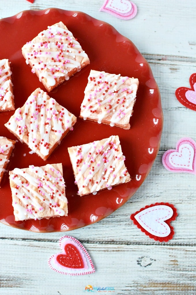 Valentine's day candy bars on a red plate.