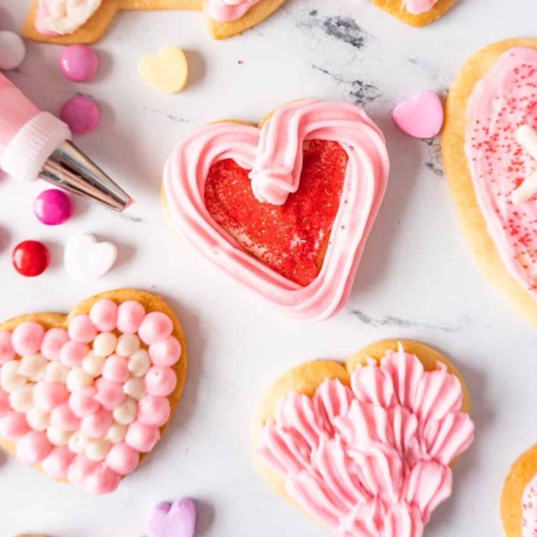Valentine's day cookies decorated with icing and sprinkles.