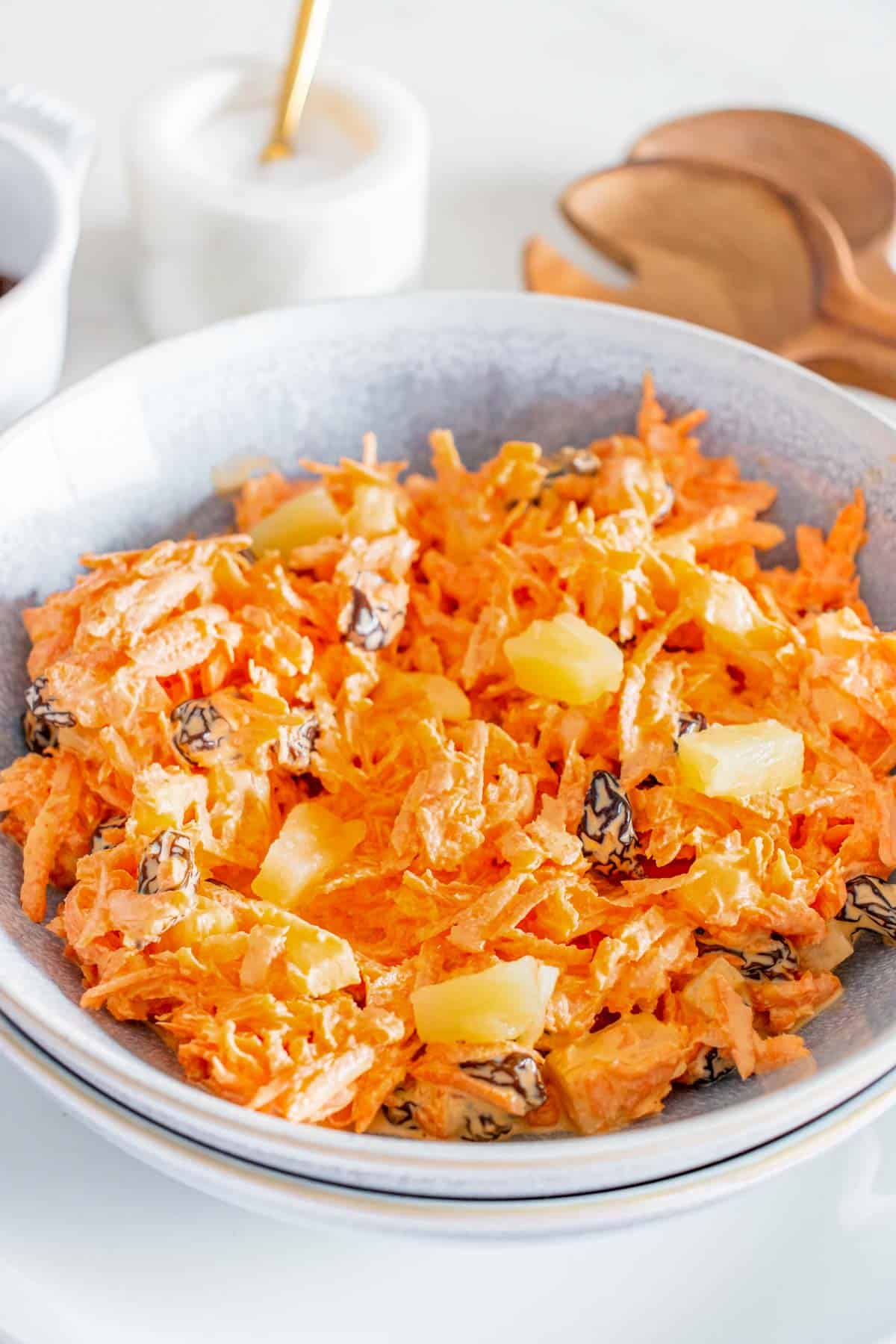 Carrot salad in a bowl on a table.