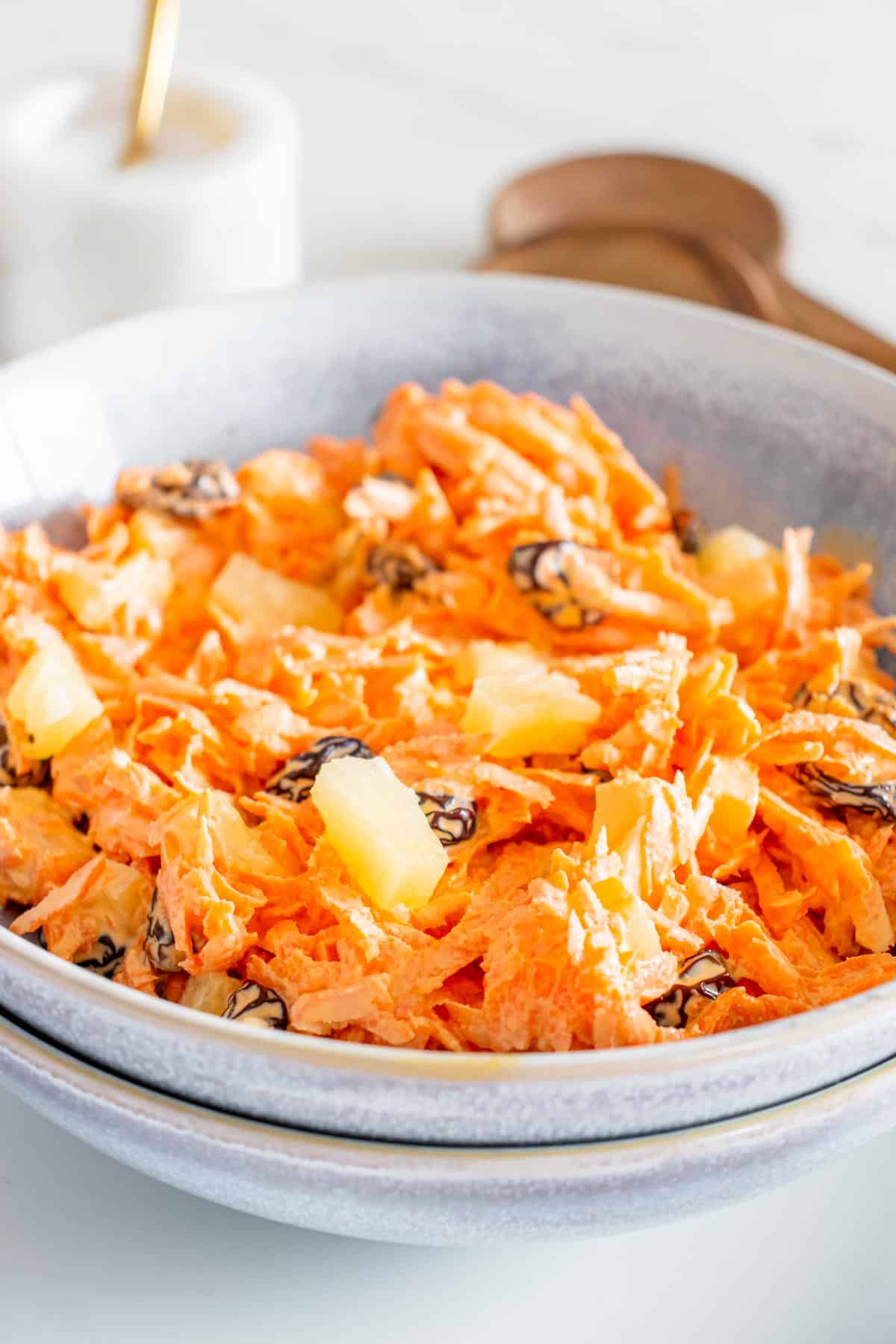 Carrot salad in a bowl on a table.
