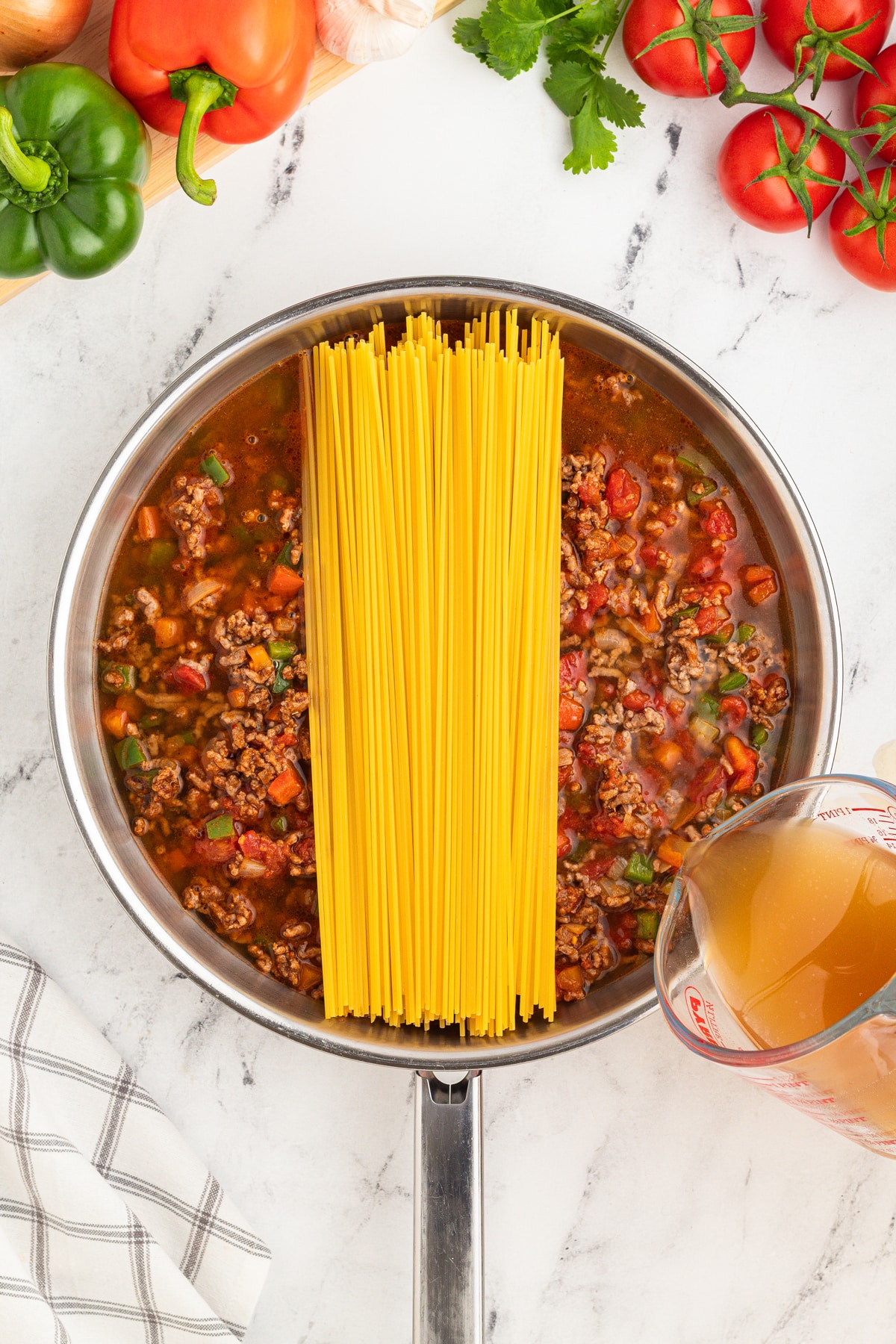 Another step in preparing Taco Spaghetti is to add the pasta noodles into the mixture.