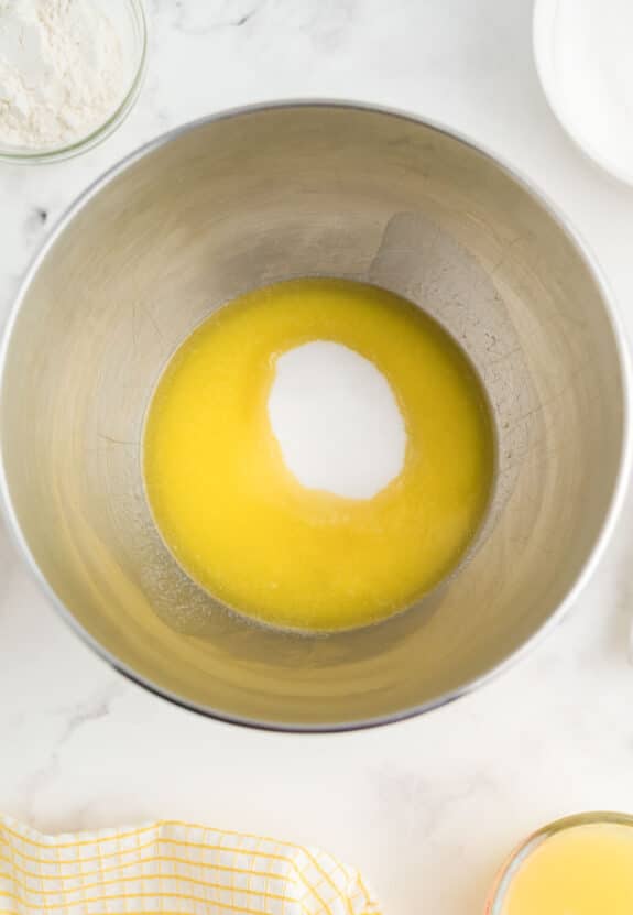 A bowl of lemon batter with sugar