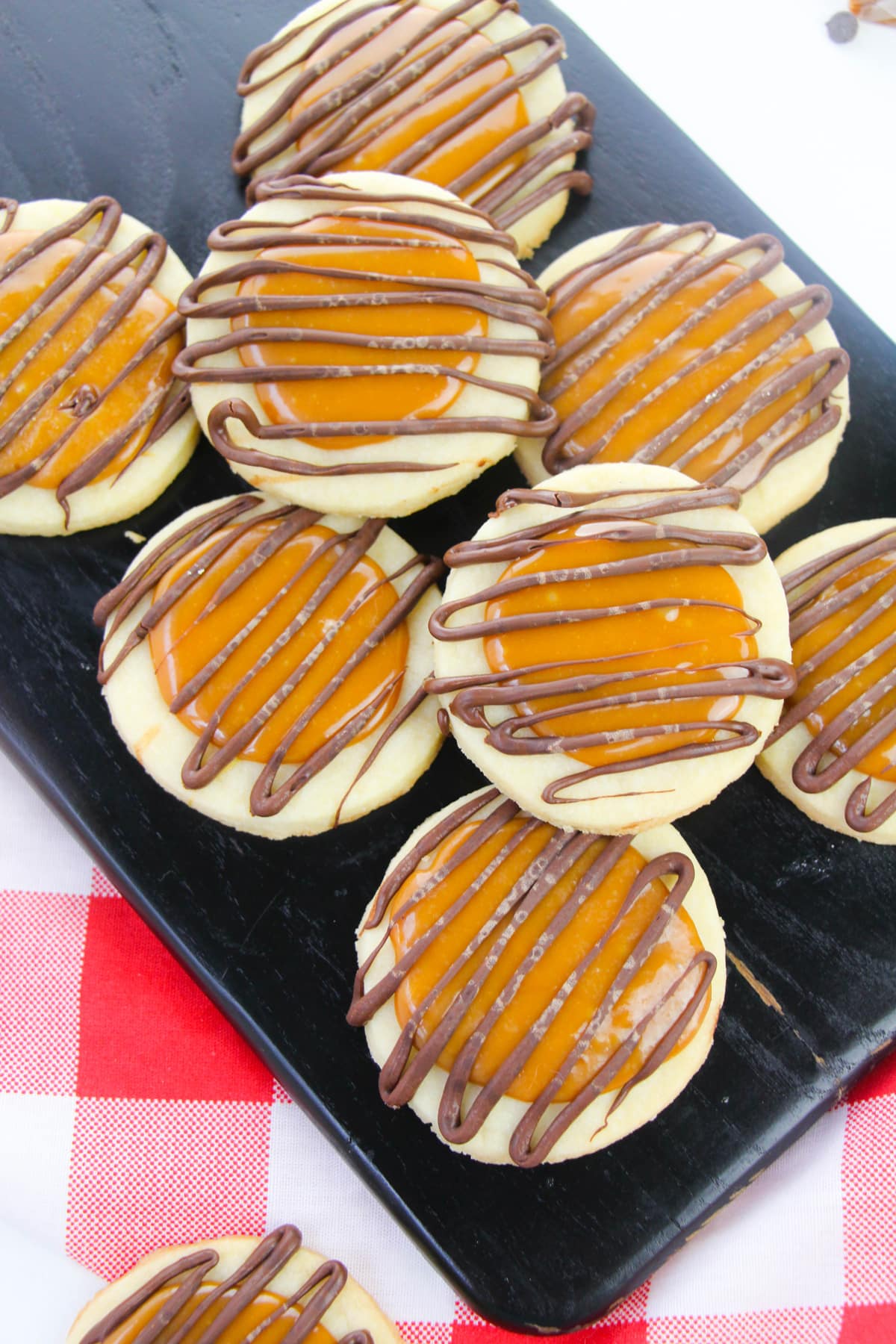 Piece of Chocolate Caramel Shortbread Cookies on a black tray