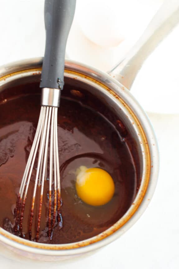 Included in the procedure of making Fudgy Mocha Brownies is to add an egg on a melted chocolate.