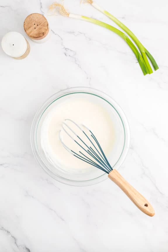 Next process is to make a dressing for Hawaiian Macaroni Salad recipe. In a bowl whisk mayonnaise, milk, apple cider vinegar and granulated sugar to a smaller mixing bowl.