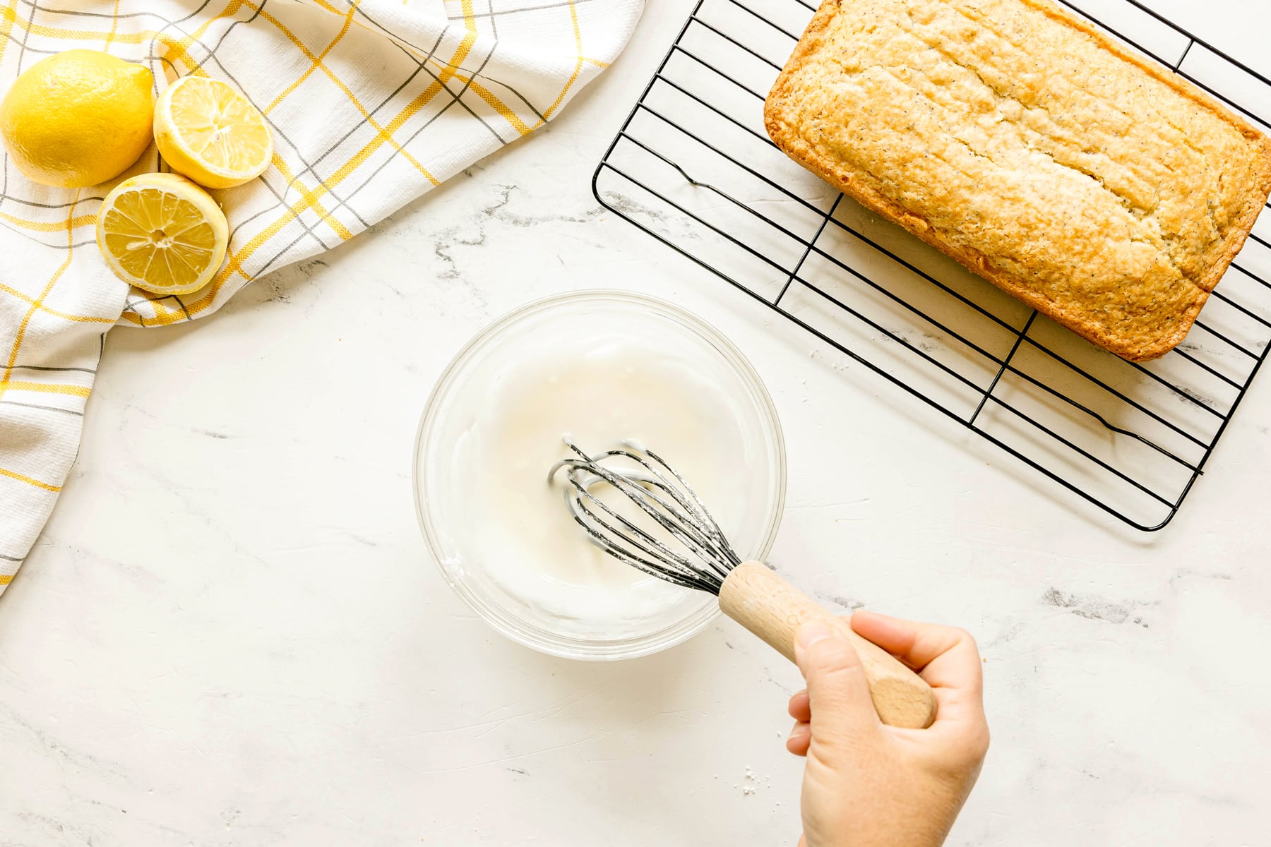 Next step in preparing Lemon Poppy Seed Bread is to make a glaze. Add powdered sugar and lemon juice until smooth.