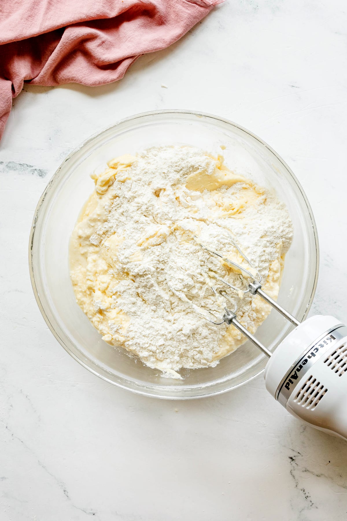 Next process in preparing Paula Deen Pound Cake is to add flour and milk in the mixture.
